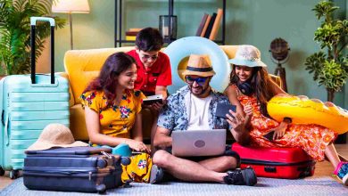 Family planning a vacation around a laptop
