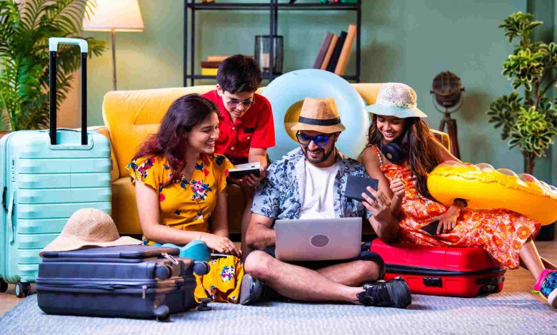 Family planning a vacation around a laptop