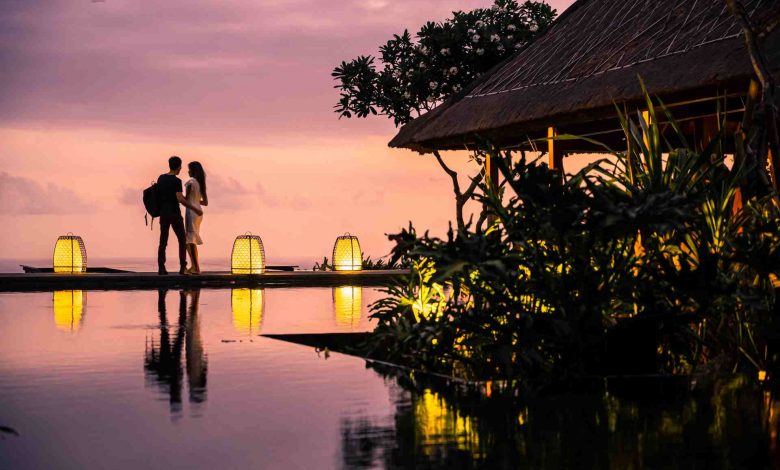 A young couple enjoying the lovely sunset at a res