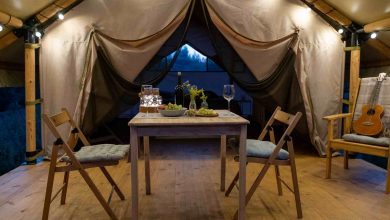 Romantic dinner setup inside of a tent