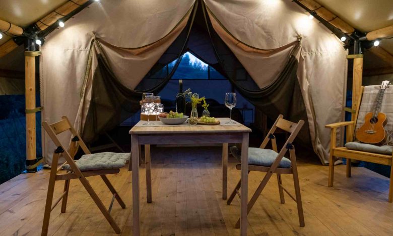 Romantic dinner setup inside of a tent