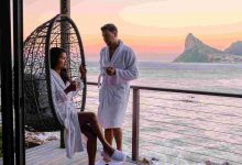 Couple man and women drinking coffee on the balcon