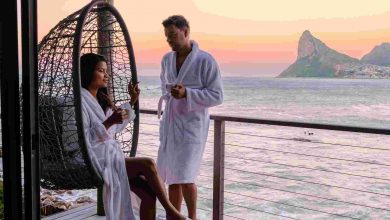 Couple man and women drinking coffee on the balcon