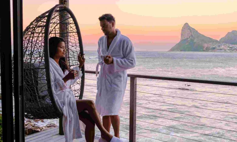 Couple man and women drinking coffee on the balcon