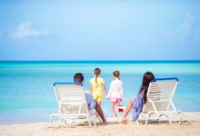 Happy beautiful family on a tropical beach vacatio