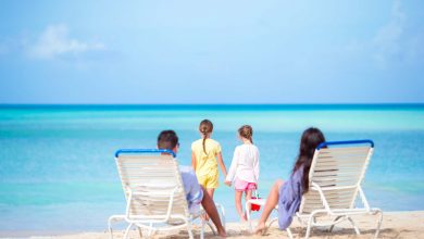 Happy beautiful family on a tropical beach vacatio