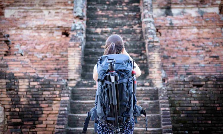 Asian beautiful girl has travel and take a photo a