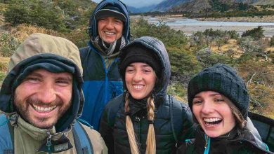 Smiling friends enjoying a hike in the mountains