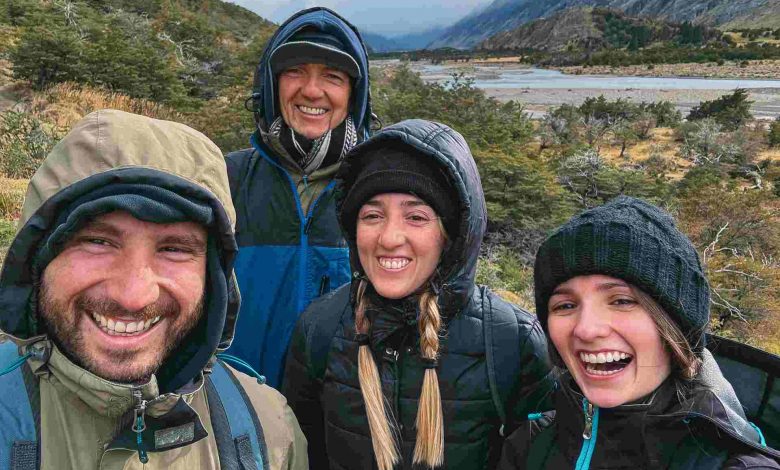 Smiling friends enjoying a hike in the mountains