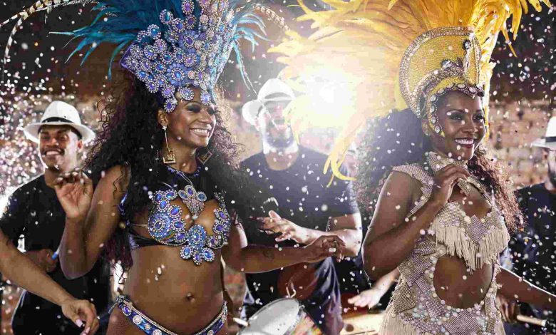 Carnival performers dancing with drummers in city