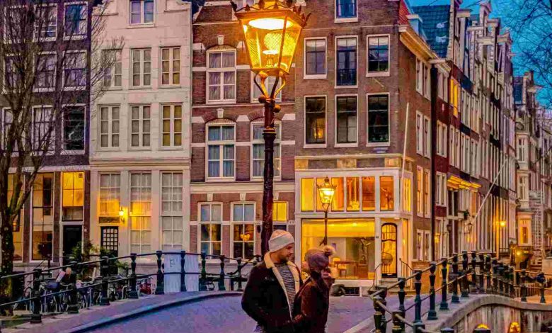 Amsterdam at night couple men and women on a city