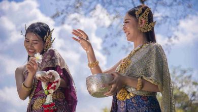 Women in traditional dress celebrate splashing wat