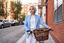 Vertical image of a muslim woman wearing a blue li
