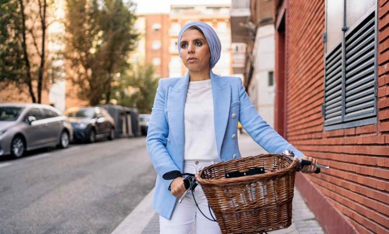 Vertical image of a muslim woman wearing a blue li