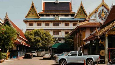 A beautiful buddhist temple with cars