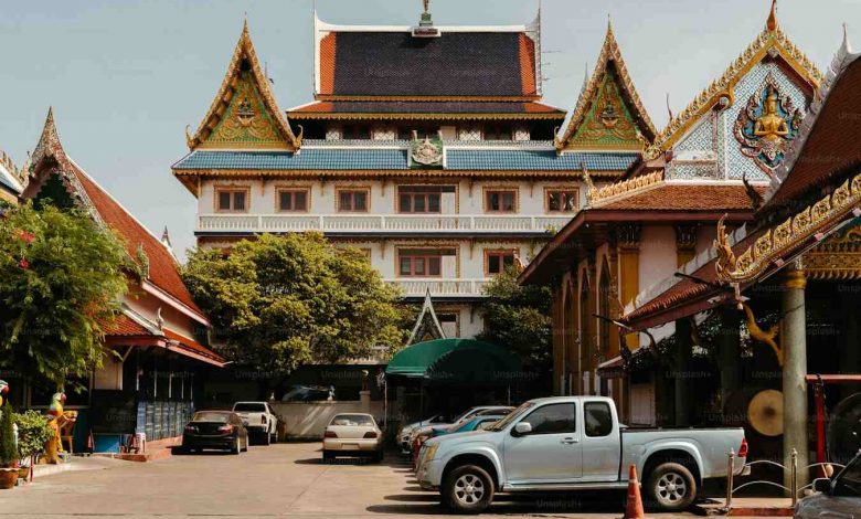 A beautiful buddhist temple with cars